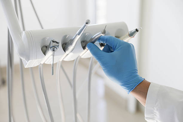 Professional Emergency Dentist technician working in Suamico, WI